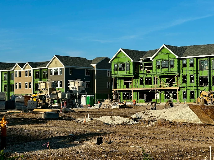 a row of houses under construction in a residential area